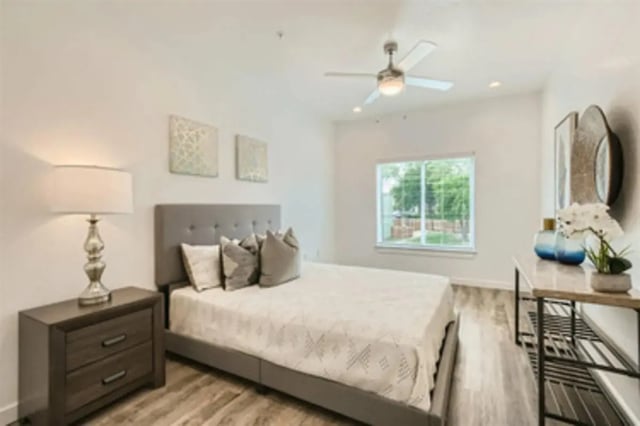 Bed nightstand lamp artwork ceiling fan bedroom at BelCara Luxury Townhomes in San Antonio Student Accommodation