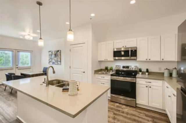Kitchen island cabinets sink stove microwave kitchen at BelCara Luxury Townhomes in San Antonio Student Accommodation