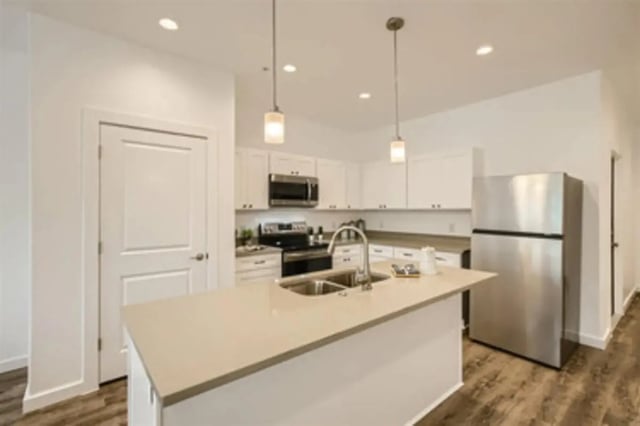 Island sink refrigerator white cabinets kitchen at BelCara Luxury Townhomes in San Antonio Student Accommodation