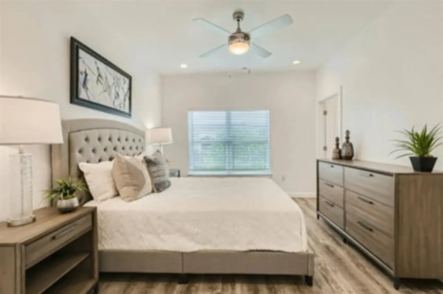 Bed with dresser and artwork bedroom at BelCara Luxury Townhomes in San Antonio Student Accommodation