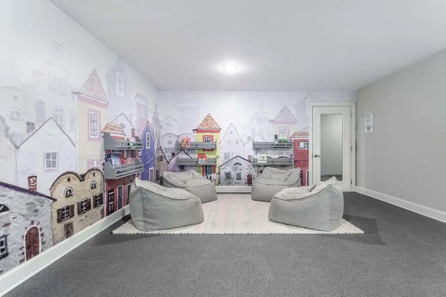 Beanbag chairs on rug in playful room playing area at Bridge at Cameron in Austin Student Accommodation