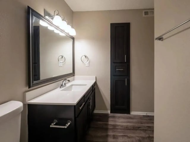 Vanity sink mirror and tall cabinet bathroom at Establishment in Austin Student Accommodation