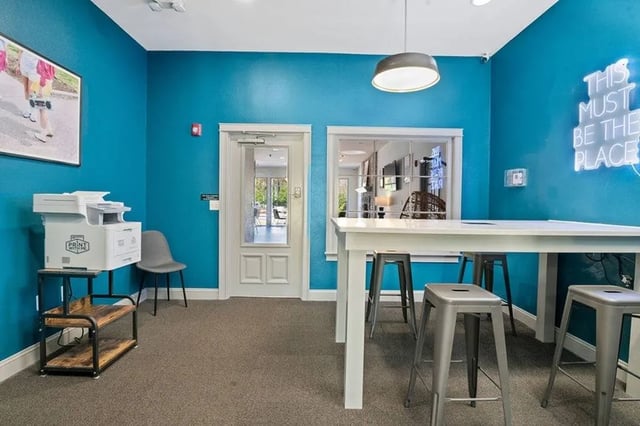 Printer stools and table communal area at Central House on Stadium in Mobile Student Accommodation