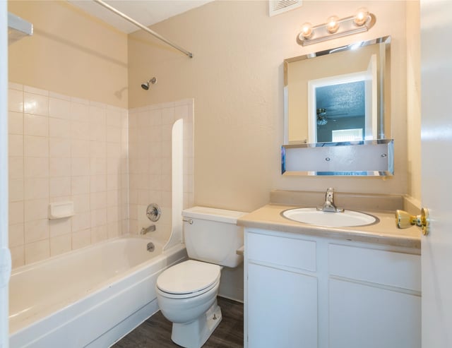 Toilet bathtub sink mirror vanity bathroom at Wind River Place Apartments in Colorado Springs Student Accommodation