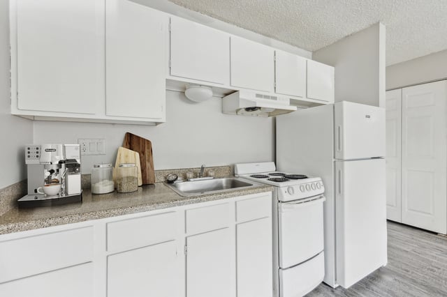 Espresso machine stove refrigerator kitchen cabinets kitchen at Wind River Place Apartments in Colorado Springs Student Accommodation