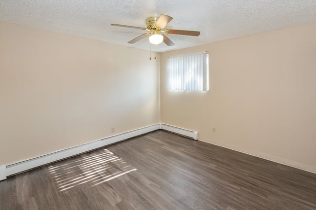 Empty room with ceiling fan and window Bedroom at Wind River Place Apartments in Colorado Springs Student Accommodation