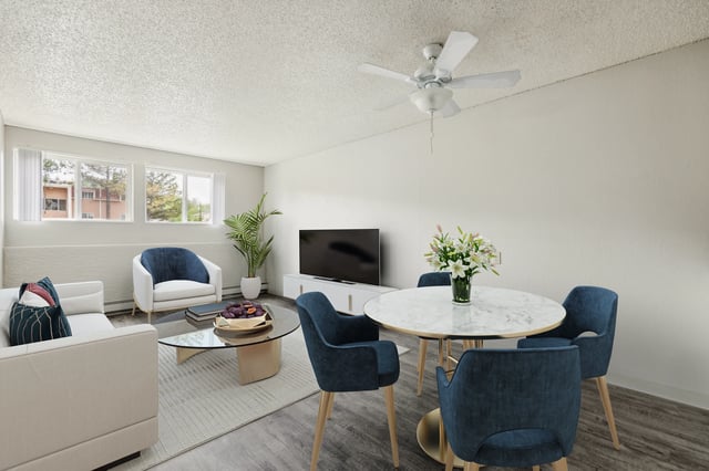 Sofa chairs television and dining table living room at Wind River Place Apartments in Colorado Springs Student Accommodation