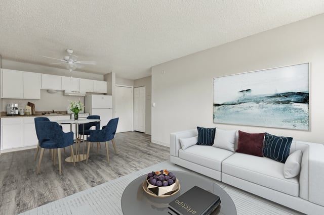 Kitchen and living area with white couch living room at Wind River Place Apartments in Colorado Springs Student Accommodation