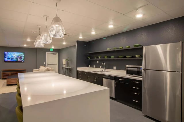 White island sink microwave and refrigerator kitchen at 1515 Flats in Denver Student Accommodation
