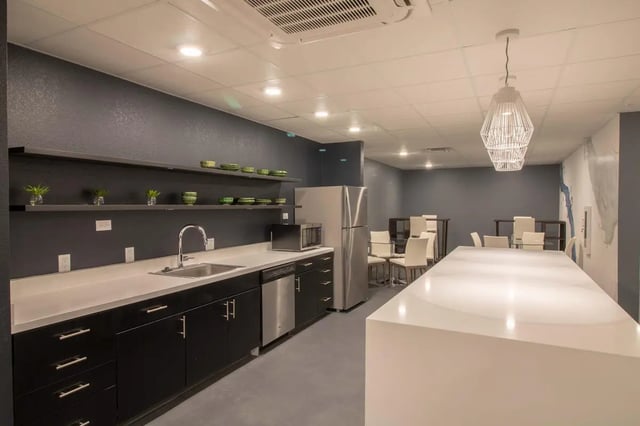 Kitchen with sink refrigerator microwave and seating kitchen at 1515 Flats in Denver Student Accommodation