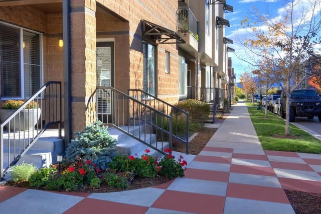 Stairs railings trees and sidewalk exterior at Uptown Broadway in Boulder Student Accommodation