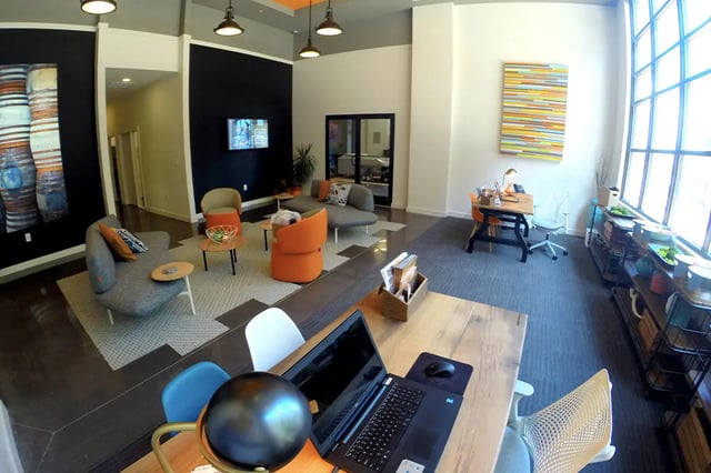 Lounge with seating study desks and artwork common area at The Knox in Knoxville Student Accommodation