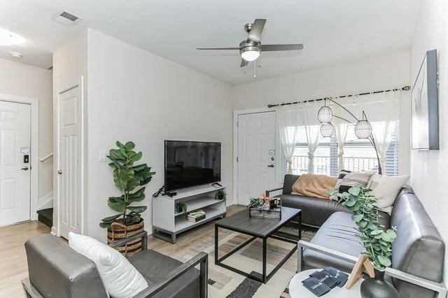 Sofa television plant coffee table living room at Copper Social in Marietta Student Accommodation