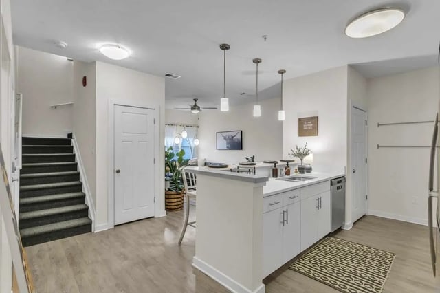 Stairs kitchen island with sink living room exterior at Copper Social in Marietta Student Accommodation