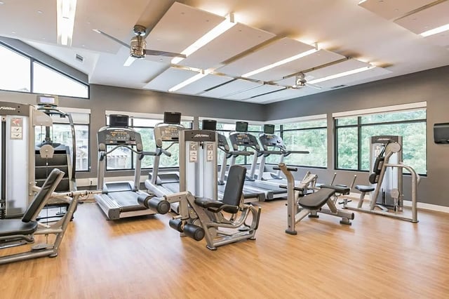 Treadmills weight machines and exercise benches gym at Copper Social in Marietta Student Accommodation