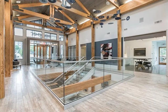 Modern lobby with stairs and seating area. at Copper Social in Marietta Student Accommodation