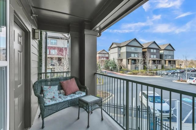 Wicker seating with cushions and table exterior at Copper Social in Marietta Student Accommodation