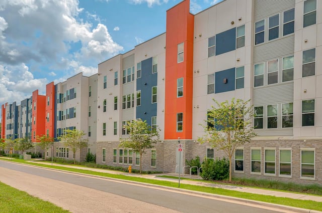 Colorful apartment building with many windows exterior at Alsander GNV in Gainesville Student Accommodation