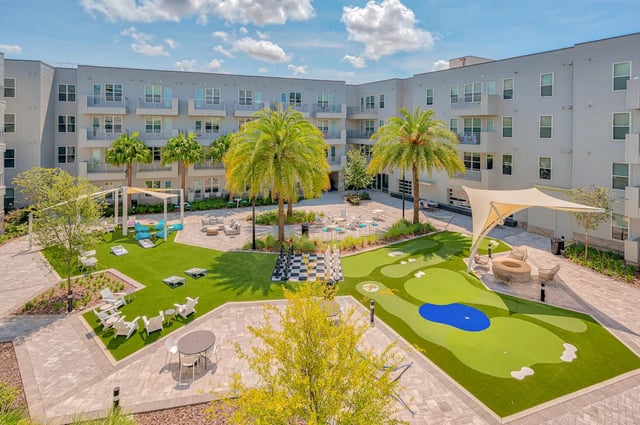 Courtyard with putting green giant chess and seating exterior at Alsander GNV in Gainesville Student Accommodation