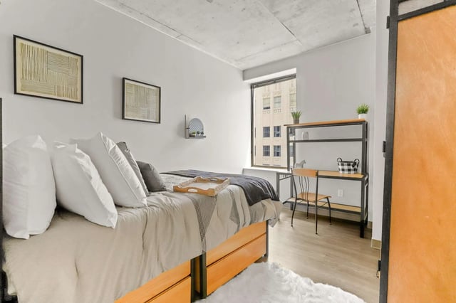 Bed study desk and chair student bedroom at Auraria Student Loft in Denver Student Accommodation