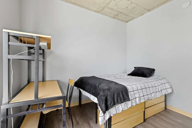 Desk bed and chair student accommodation bedroom at Auraria Student Loft in Denver Student Accommodation