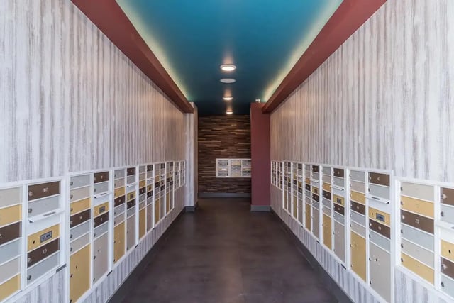 Rows of mailboxes with textured walls and ceiling. Exterior at Gateway on Cullen in Houston Student Accommodation