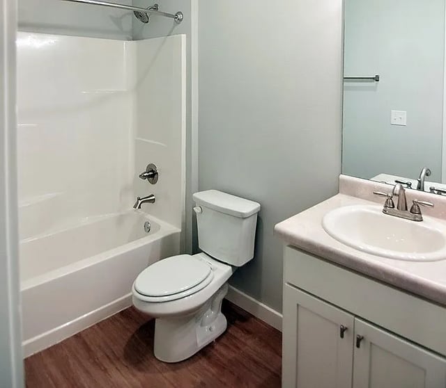 White bathtub toilet sink and vanity bathroom at Rhelm in Pensacola Student Accommodation