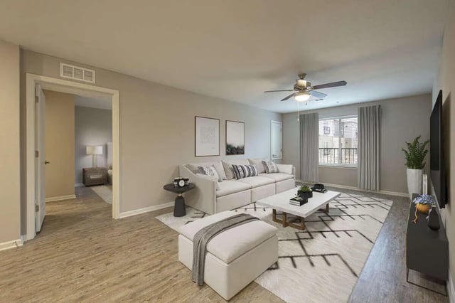 White sectional sofa ottoman coffee table living room at Goodnight Commons in Austin Student Accommodation