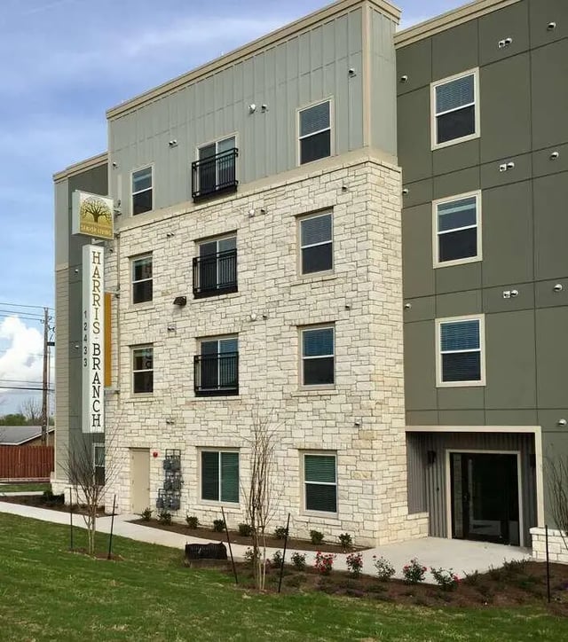 Building with stone and metal exterior exterior at Harris Branch Senior in Austin Student Accommodation