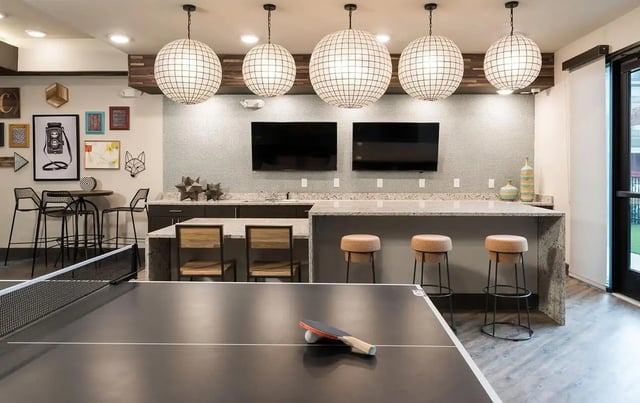 Ping pong table bar area and TVs common room at Gateway on Cullen in Houston Student Accommodation