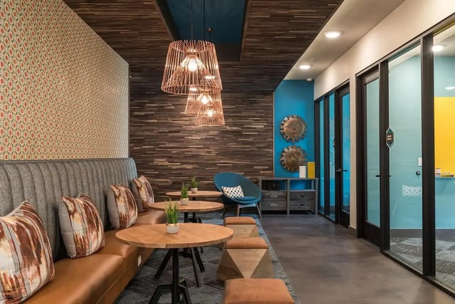 Seating area with tables and chairs living room at Gateway on Cullen in Houston Student Accommodation