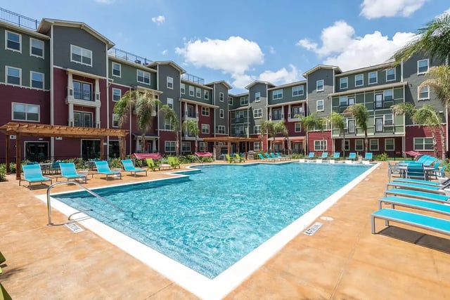 Apartment complex pool with lounge chairs exterior at Gateway on Cullen in Houston Student Accommodation
