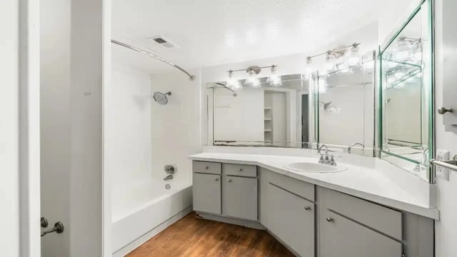 White tub shower vanity and sink bathroom at Ironhorse Flats in Austin Student Accommodation