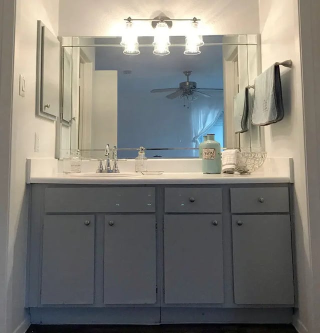 Vanity with sink mirror and towels bathroom at Ironhorse Flats in Austin Student Accommodation