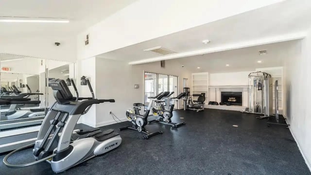 Elliptical machine stationary bikes and weight machine fitness area at Ironhorse Flats in Austin Student Accommodation