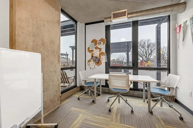 Study table chairs whiteboard corkboard study area at Vista in Denver Student Accommodation