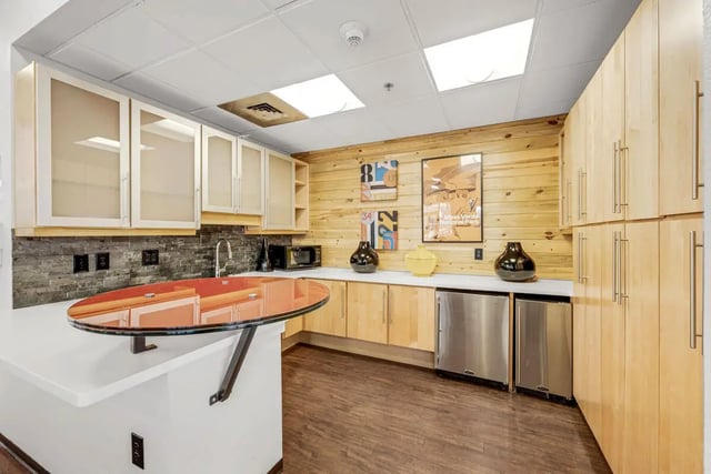 Kitchen with oval counter artwork and appliances kitchen at Vista in Denver Student Accommodation