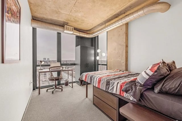 Bed desk wardrobe large window bedroom at Vista in Denver Student Accommodation