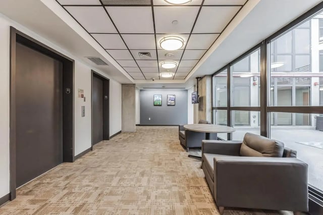 Two elevators carpeted floor seating area lobby at Vista in Denver Student Accommodation