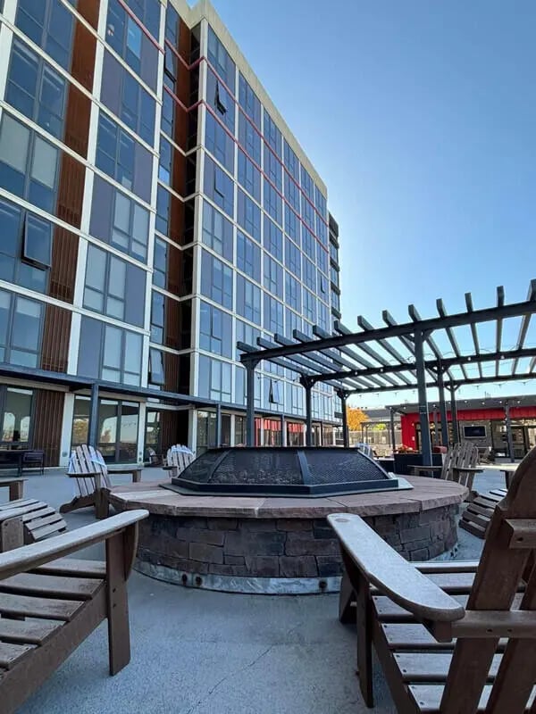 Fire pit with chairs outside building exterior at Vista in Denver Student Accommodation