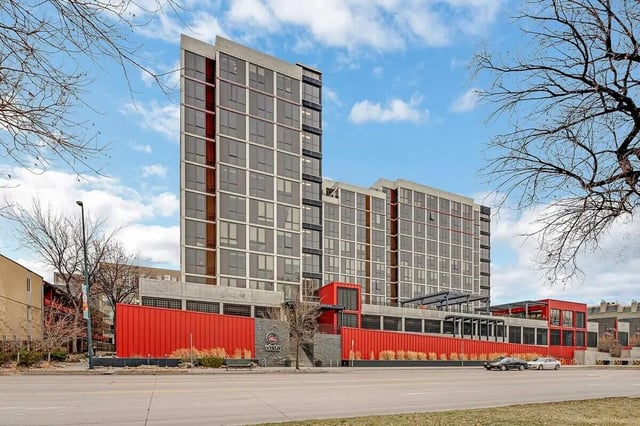 Modern building with red accents and windows exterior at Vista in Denver Student Accommodation