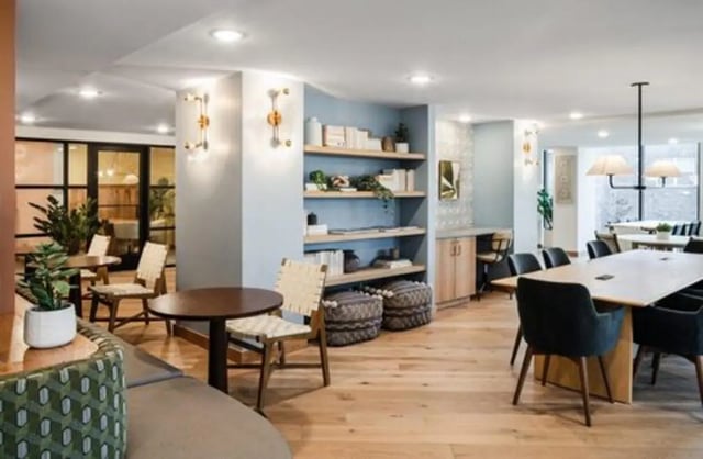 Seating tables shelving and desks common area at Rambler Austin in Austin Student Accommodation