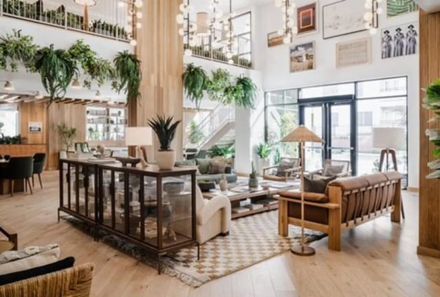 Lounge with plants and seating. Living area. at Rambler Austin in Austin Student Accommodation