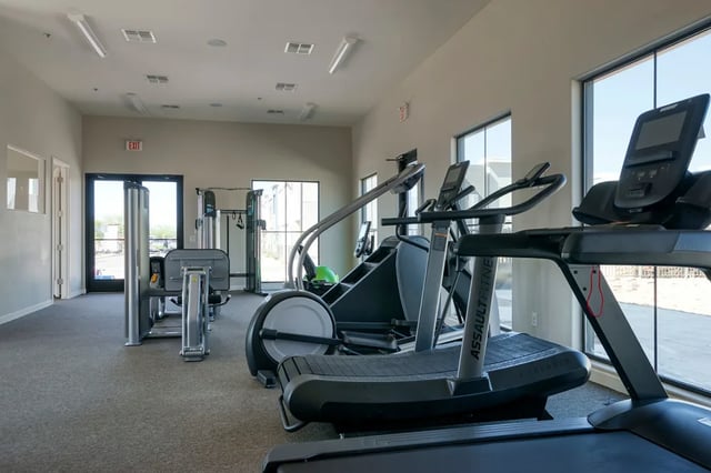 Treadmills ellipticals weight machines fitness room at BB Living at Val Vista in Gilbert Student Accommodation