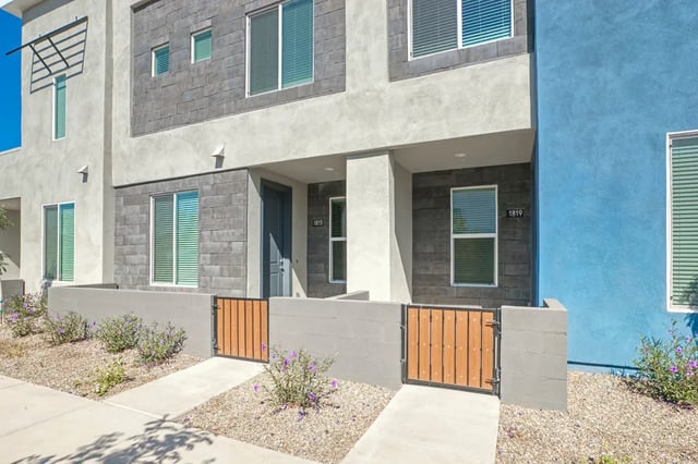 Modern townhouses with blue and grey exterior exterior at BB Living at Val Vista in Gilbert Student Accommodation