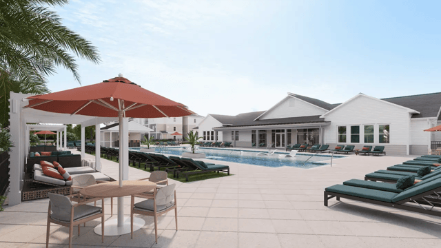 Pool lounge chairs umbrellas and dining table exterior at Ten60 Halifax in Daytona Beach Student Accommodation