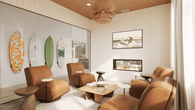 Surfboards chairs fireplace lounge area at Ten60 Halifax in Daytona Beach Student Accommodation