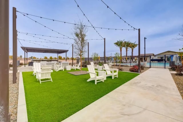 White chairs string lights pergola pool area exterior at BB Living at Civic Square in Goodyear Student Accommodation