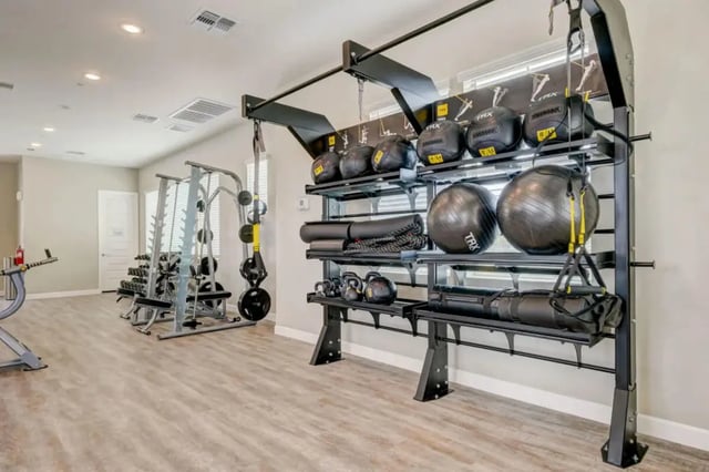 Weight rack exercise balls yoga mats workout area at BB Living at Civic Square in Goodyear Student Accommodation
