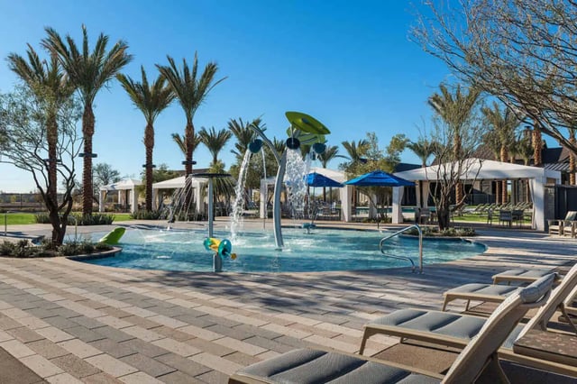 Water feature splash pad palm trees lounge chairs pool area at BB Living at Civic Square in Goodyear Student Accommodation